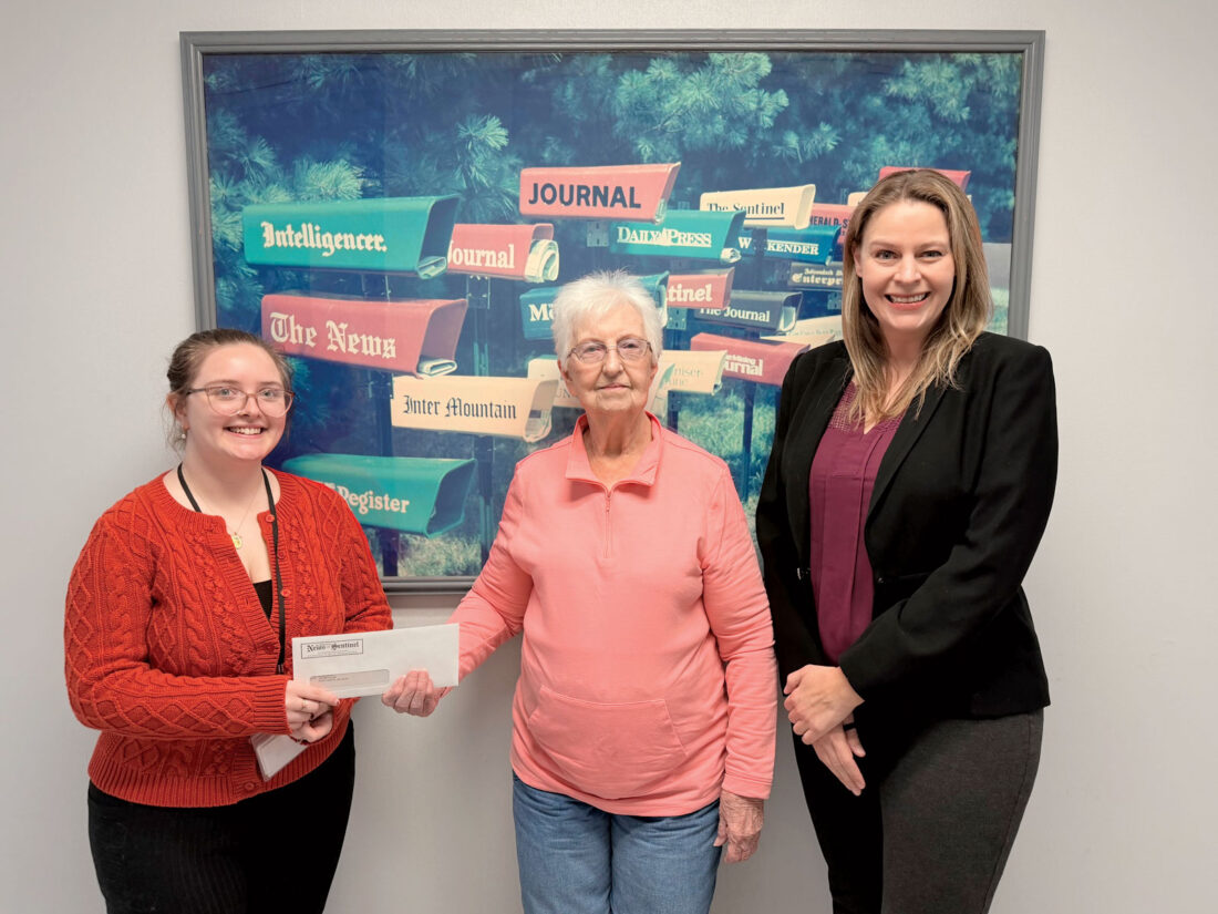 Anna Dean, center, receives a $500 check for winning the grand prize of the 71st annual Cookbook Contest which is held by The Parkersburg News and Sentinel/The Marietta Times. Dean submitted an apple bundt cake recipe for the Baked Goods Battle category. The contest was held Oct. 22 with first place winners of each category announced the day after the contest took place. Also pictured is Times Copy Editor Gretchen Dowler, left, and Executive Editor Christina Myer. (Photo by Amber Phipps)